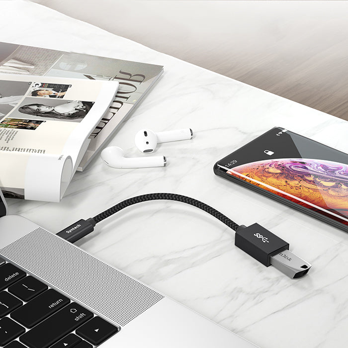 usb c to usb adapter connected with usb and laptop
