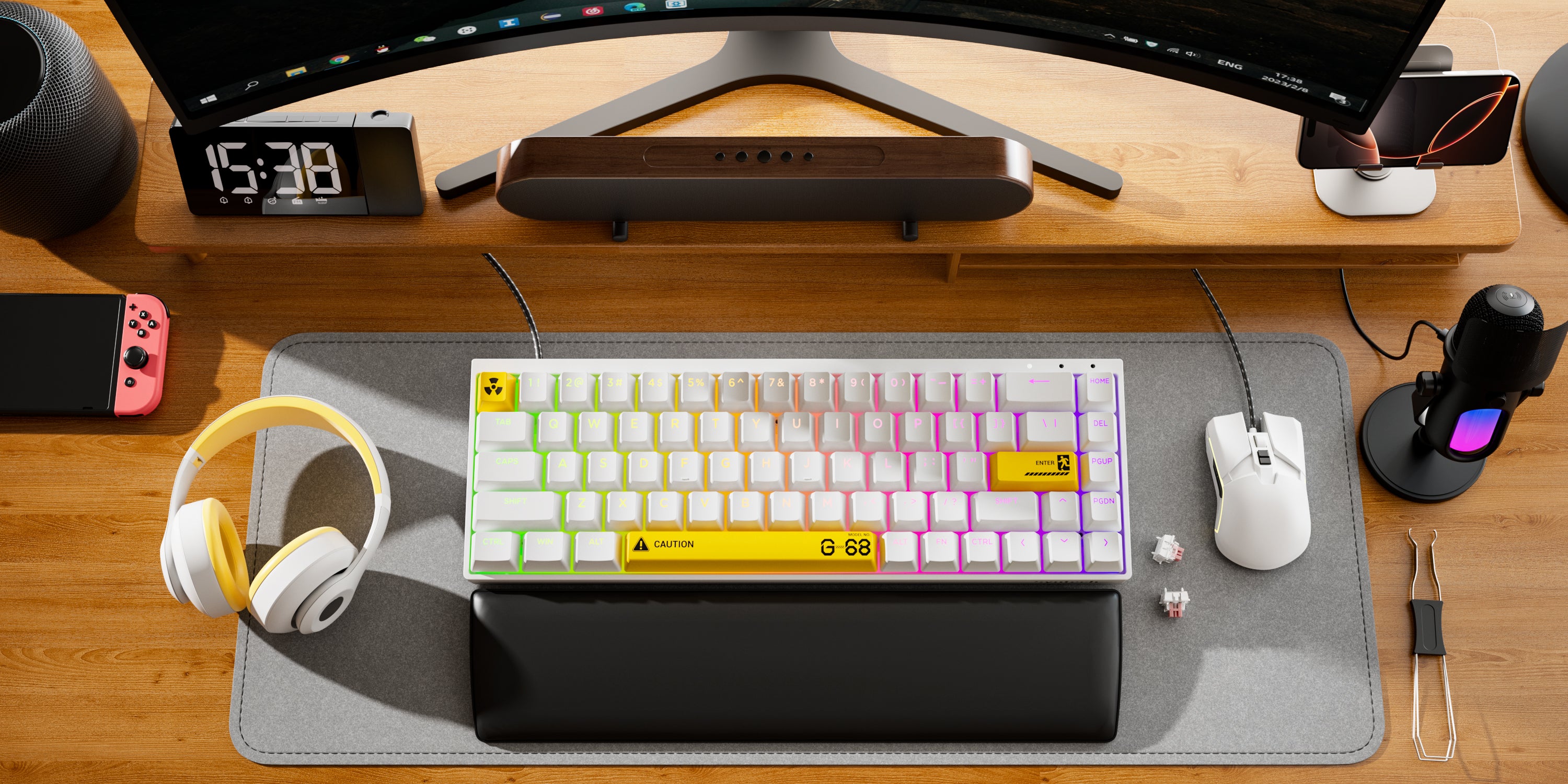 Chronos 68 HE Keyboard on a desk with a switch and Syntech's Microphone.